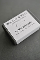 Witte breimarkeerders in bewaardoosje