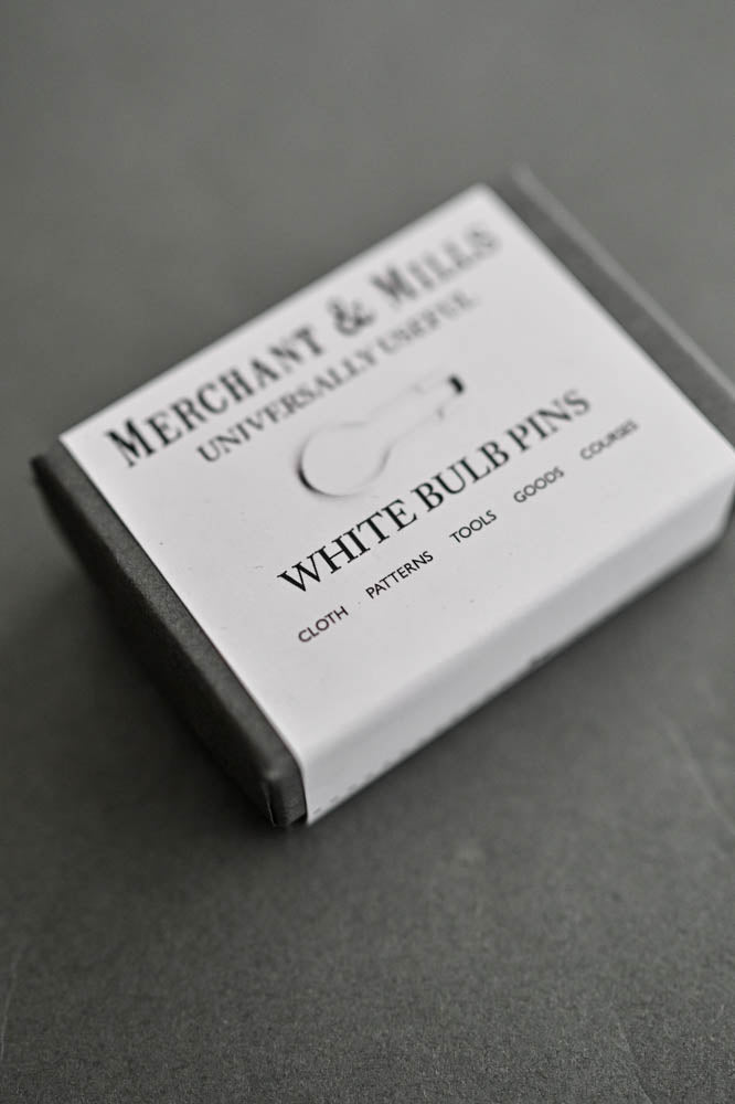 Witte breimarkeerders in bewaardoosje