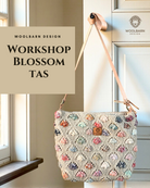 Blossom Bag: gebreide schoudertas met kleurrijke bloemetjes en leren riem